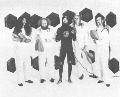 [Karamazov Brothers show drum machines, photo]